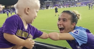 Toddler And Footballer Without Forearm Bond In Heartwarming Picture